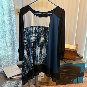 Loose fitting swing shirt with ruching on the sleeve